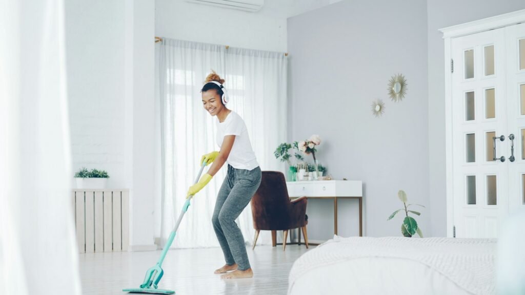 Woodbury move-out cleaning: a cleaner mopping the floor of a bright room